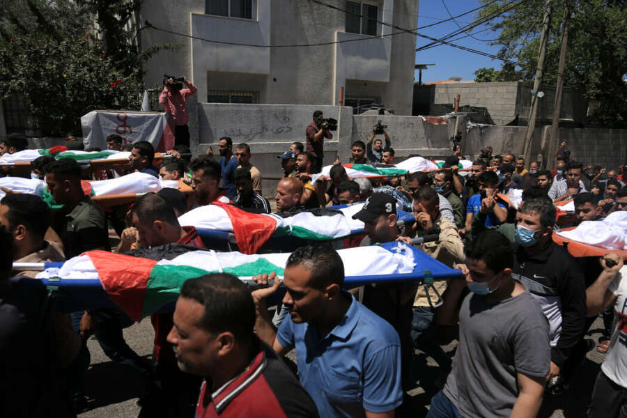 Palestinians carrying the bodies of children from the Abu Hatab family who were killed in an Israeli airstrike.Samar Abu Elouf for The New York Times